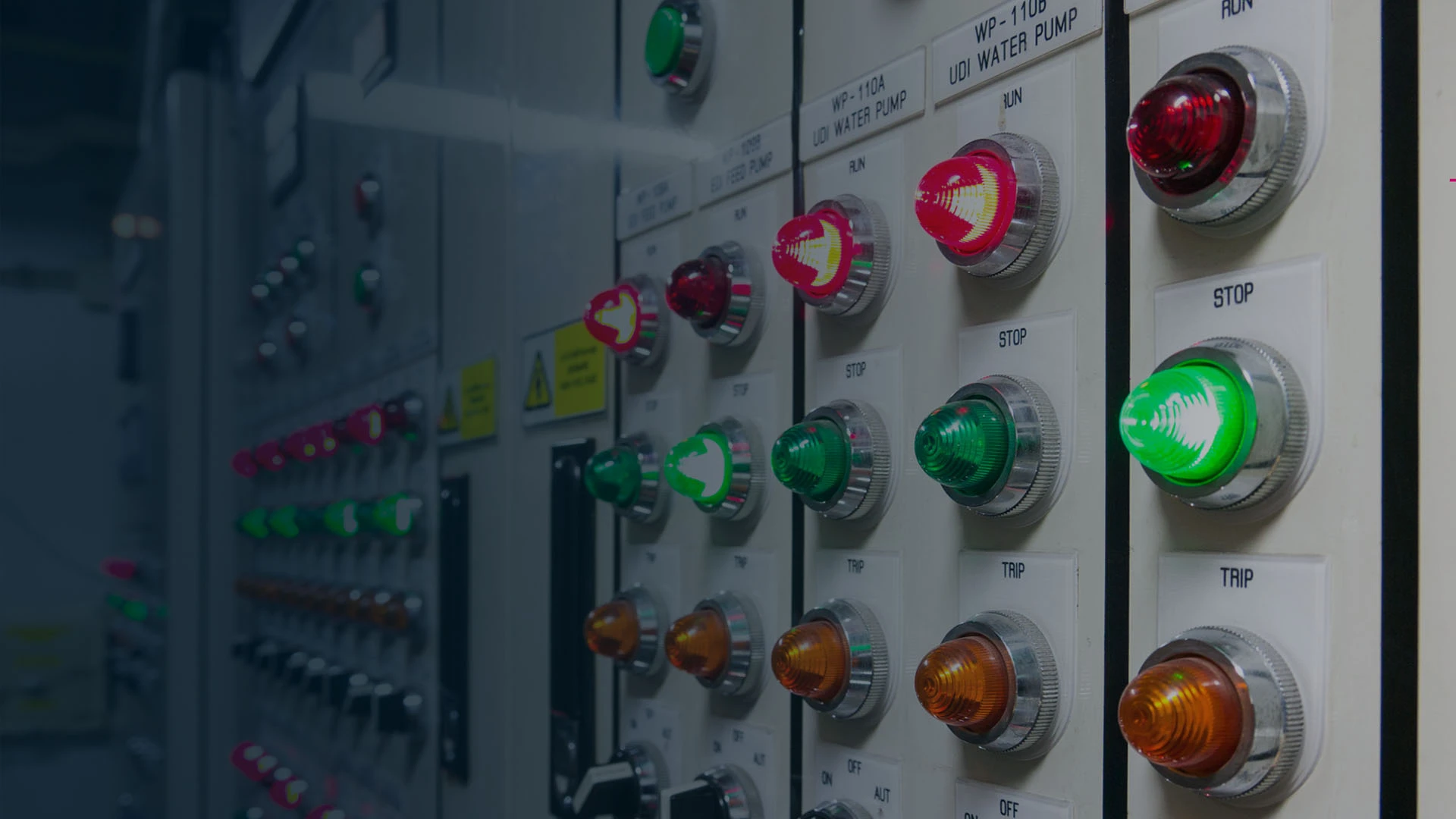 Alarm management solutions banner of a wall of sensor and alarm lights